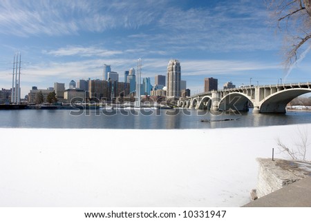 A picture of Minneapolis cityscape across icy river