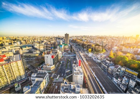 Asia Business concept for real estate and corporate construction - panoramic modern city skyline aerial view of oji, taito & sumida area with railway under twilight sky in Tokyo, Japan