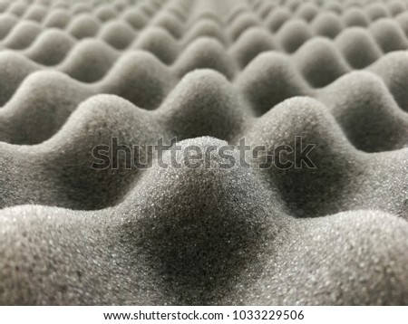 Foam or sponge for the recording room, gray texture background.