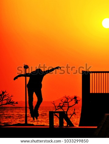 Skate boy seaside at sunset