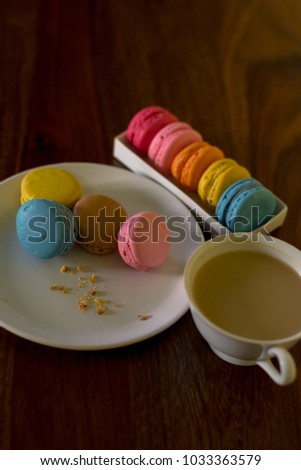 Delicious macaroons on the wooden table, with copy space
