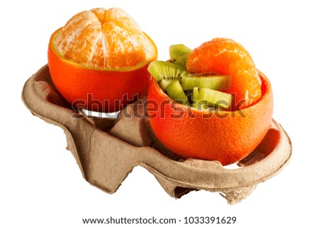 orange fruit and orange peel on the cardboard stand