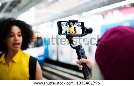 Young adult woman traveling and blogging social media concept Royalty-Free Stock Photo #1033401796