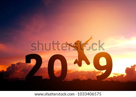 Newyear 2019 concept Silhouette young woman jumping to 2019 new year Royalty-Free Stock Photo #1033406575