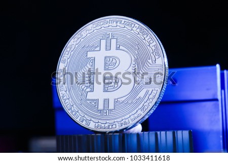 Image of crypto currency, bitcoin and processor on blue background