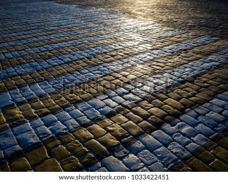 Photo of yellow gray cobblestones