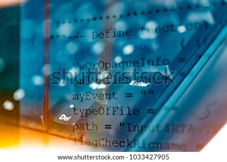 Software code development as concept. Double exposure of programming code screen and computer for software developing.