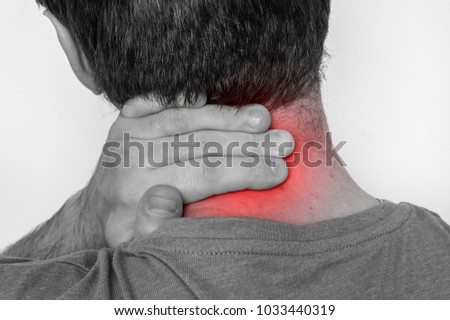 Man with muscle injury having pain in his neck - black and white photo