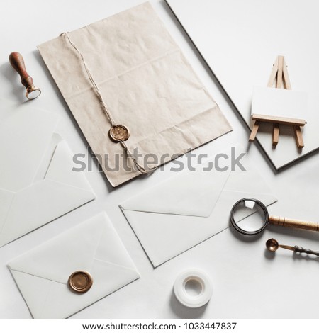 Photo of blank vintage stationery set on paper background. Mock up for branding identity. ID template.