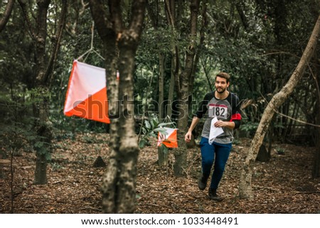 Outdoor orienteering check point activity Royalty-Free Stock Photo #1033448491