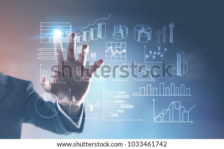 Hand of an unrecognizable businessman interacting with a visual screen element. Infographics. Blurred blue background. Toned image double exposure mock up