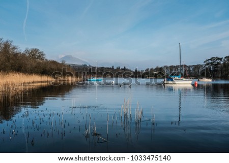 Moored boats and clear sky on Coniston water, Lake District