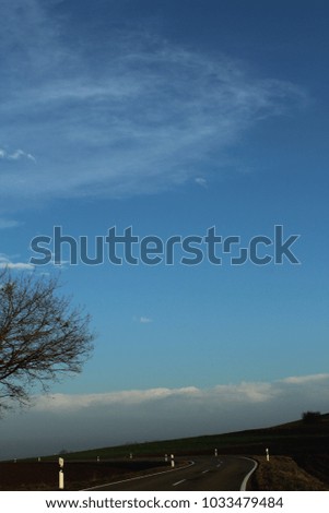 blue sky with chemical clouds
