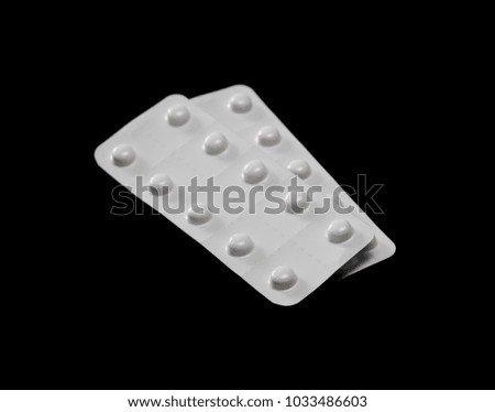 Tablets in blister pack, medicine, isolated on black background