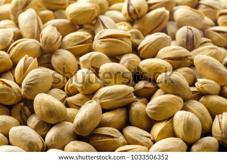 Pistachio nuts. A close-up photograph. Unrefined whole kernel