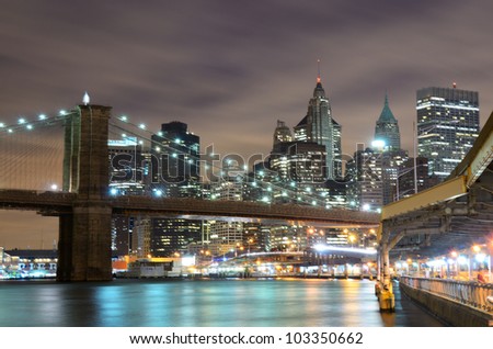 Brooklyn Bridge spanning the East River towards Manhattan in New York City.