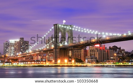 Brooklyn Bridge spanning the East River towards Brooklyn in New York City.