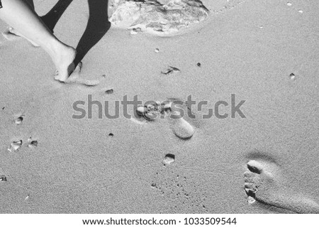 a footprints in the sand on the beach