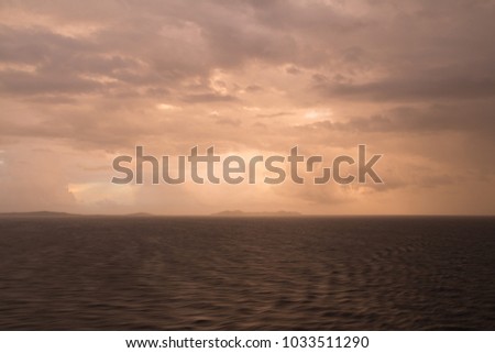 In the photo you see a wonderful sunset in the sea, the picture is taken from the ship.