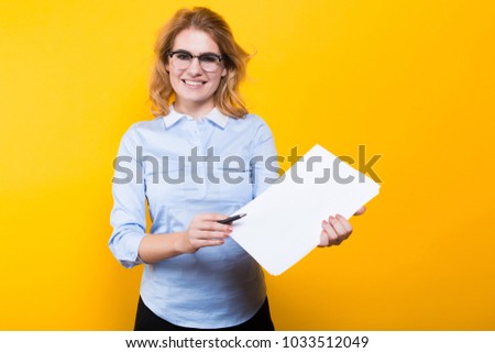 Blonde woman with blank paper and pen
