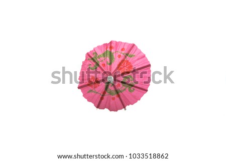 pink cocktail umbrella isolated on white background