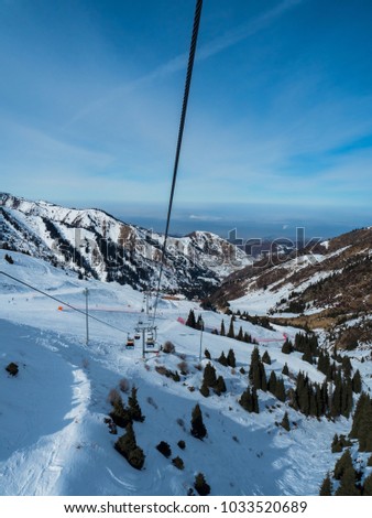 Ski lift in Almaty mountains. Shymbulak Ski Resort Hotel in Almaty city, Kazakhstan, Central Asia.