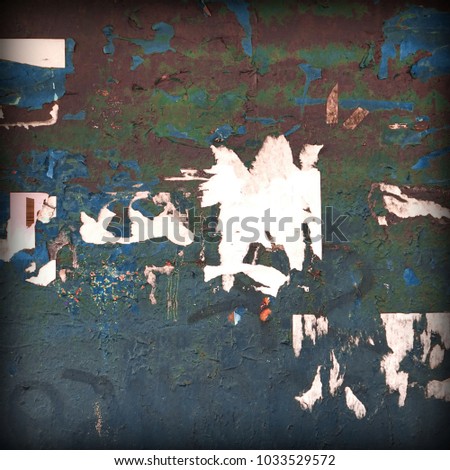 Old Billboard With Torn Poster Paper Ads And Stickers. Frame Background Or Square Texture. Vintage Urban Grunge Wallpaper For Design And Artwork With Copy Space For Text Or Image.