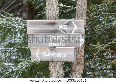 General sign in Finnish language: WC = Toilet, Sauna = Sauna, Sähkösauna = Electric Sauna