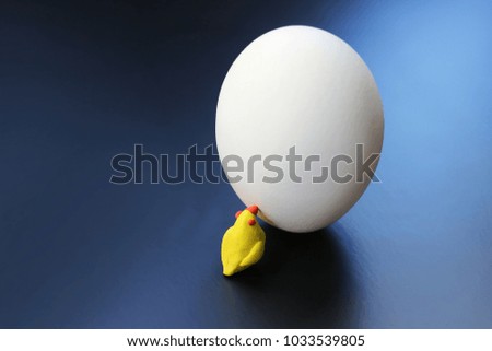 chicken egg and plasticine toy chicken