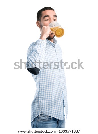 Young man drinking a pint of beer