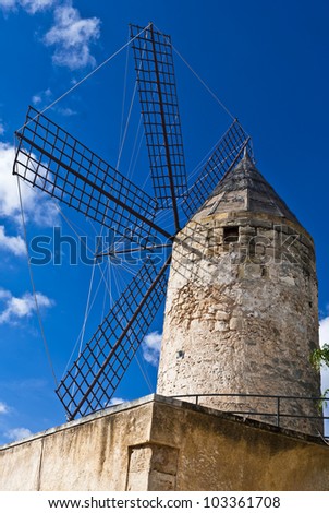 The picture shows a traditional windmill in Palma de Majorca, Spain.