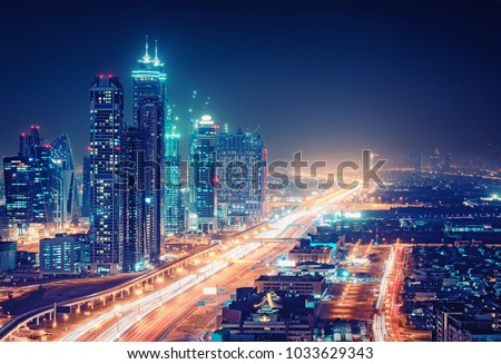 Spectacular nighttime skyline of a big modern city at night
. Dubai, UAE. Aerial view on highways and skyscrapers. Royalty-Free Stock Photo #1033629343