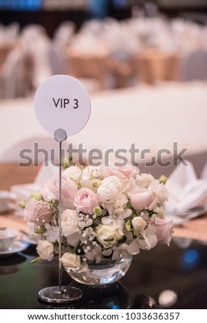 Small sign (VIP) placed on the table. At the wedding ceremony.