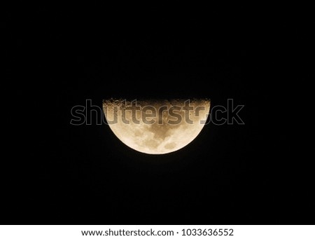Half moon in the dark night.