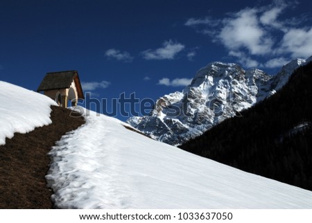 Little Chapel and Cima Dieci on background on Dolomites mountains, Alta Badia. Trentino Alto-Adige, Italy.