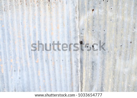 grey abandoned urban metal fence with spray paint and splashes 