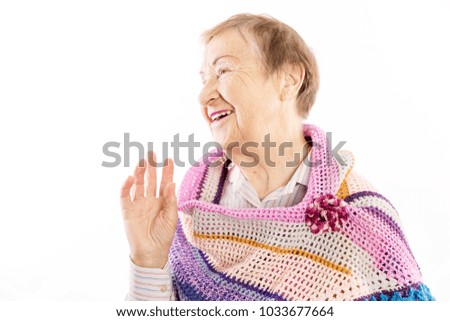 Cute old woman with gray curly hair smiling
