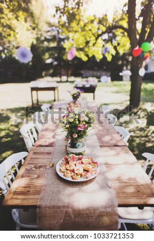 Table set for a garden party or celebration outside.