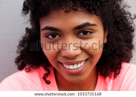 Close up portrait of young african american girl smiling