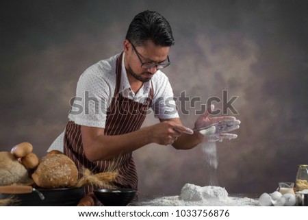 Chef hipster stylish Sift flour to make bread on the beautiful background.