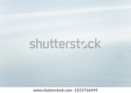 Beautiful fresh snow pattern in minimalistic style. Winter background. Norway, Northern Europe. Close up texture