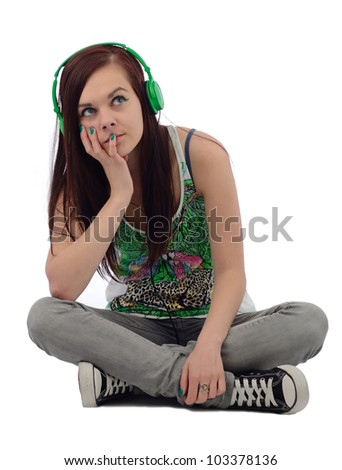 Young brunette dreaming with music