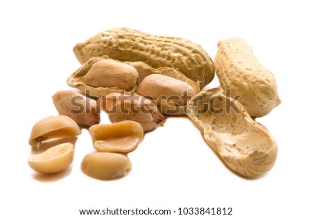 Roasted and dried peanuts in strange shape on white background, isolated picture