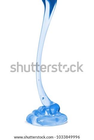 Transparent viscous liquid flows against a white background close-up Royalty-Free Stock Photo #1033849996