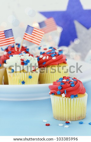 American patriotic themed cupcakes for the 4th of July. Shallow depth of field with selective focus on cupcake in foreground.