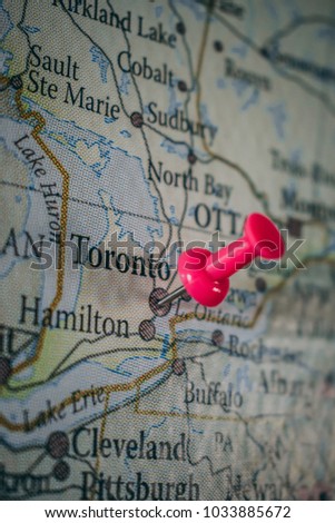 Toronto pinned on old vintage world map of Canada, travel destination, travel concept