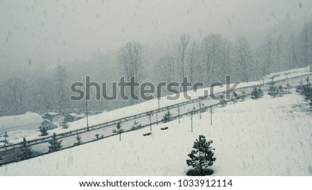 A large snowfall overlooking the road, heavy snow and snowstorm, 4k.