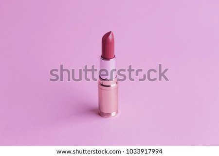 Fashion lipstick on pink background