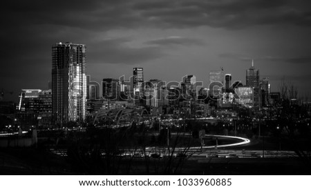 Panorama of downtown Denver, Colorado, the mile high city, Denver's skyline in long exposure at dusk with light trails.