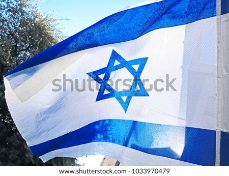 Israel flag. White and blue colors. Israel flag waving against sky